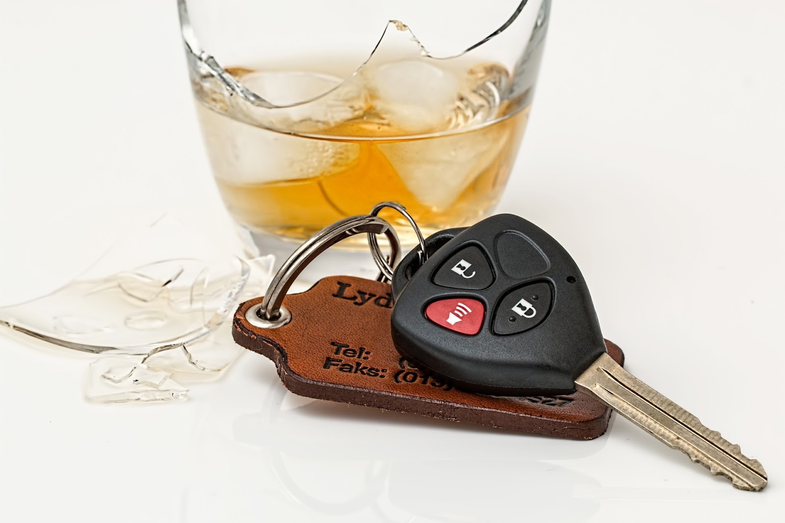 car key next to a drink